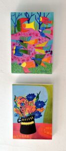 Photo depicting two wooden blocks with artwork printed onto it.